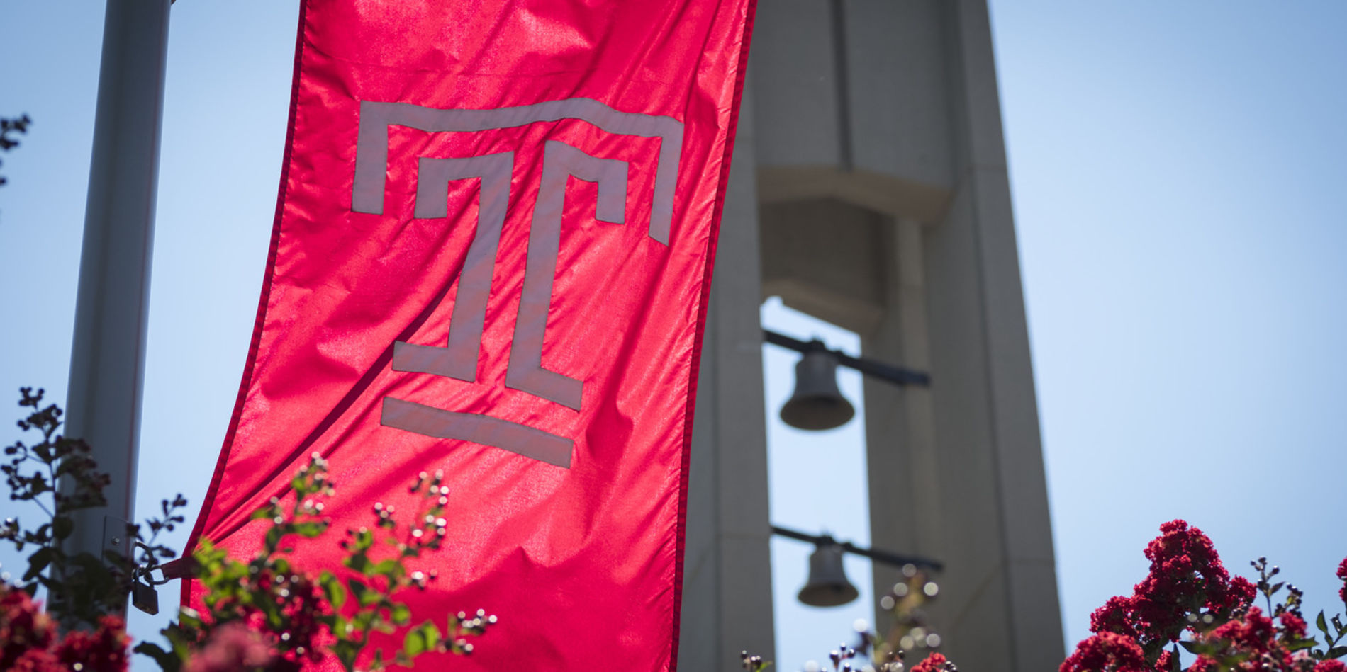 A Temple flag flying in front of the Bell Tower.